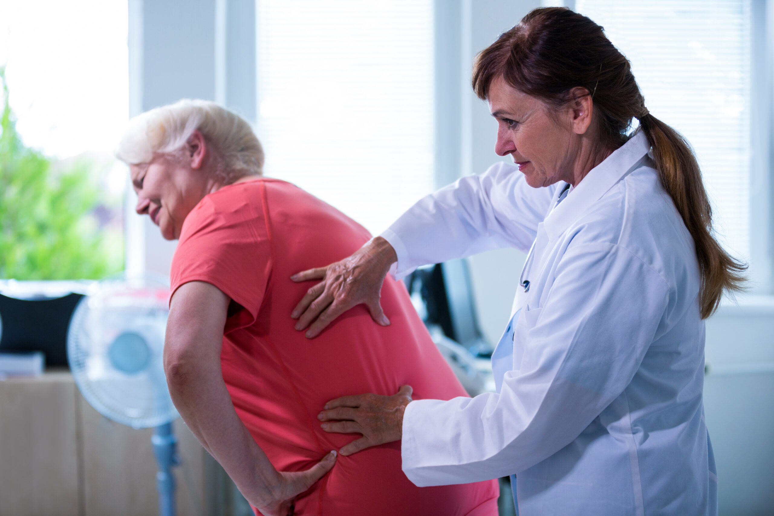 female doctor examining a patient