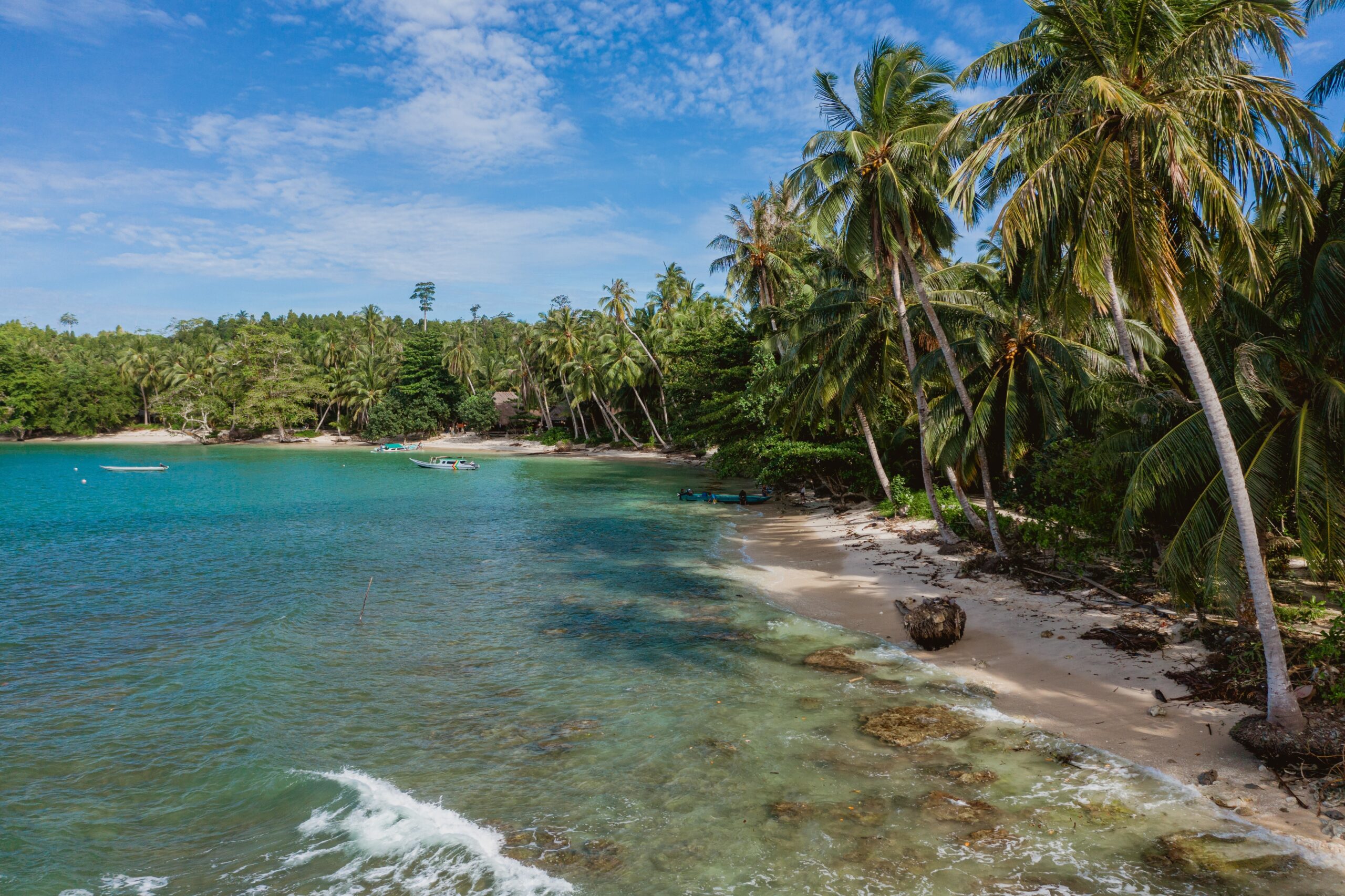mesmerizing view of the coastline with white sand and turquoise clear water in indonesia